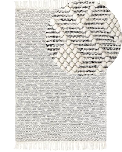 Teppich schwarz / weiß aus Wolle 160 x 230 cm Kurzflor mit Fransen modern Kavak von Beliani