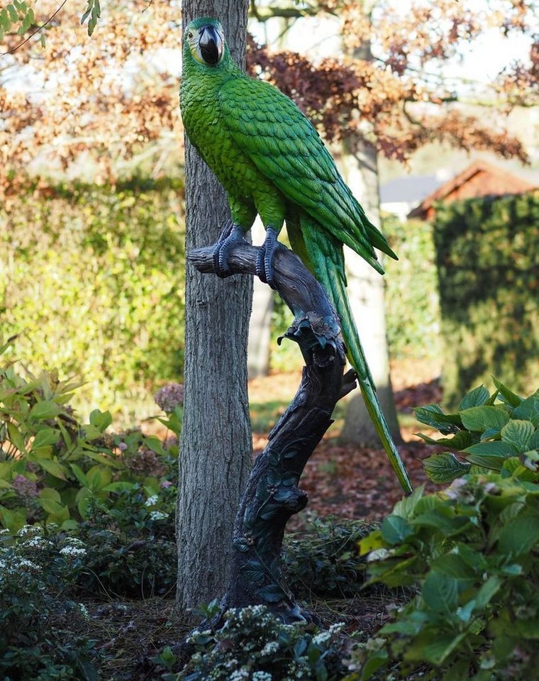 Bronzeskulpturen Skulptur Bronzefigur grüner Papagei auf Baumstamm von Bronzeskulpturen