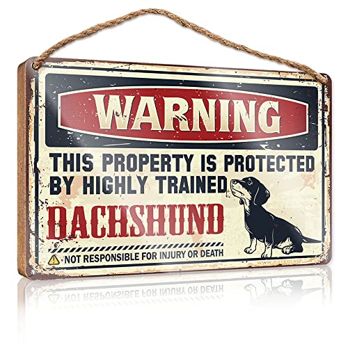 Schild zum Aufhängen zu Hause, Warnung dieses Eigentums ist durch einen hochtrainierten Dackel geschützt, Willkommensschild aus Holz, Türschilder (Größe: 15 x 28 cm) von CakJuice