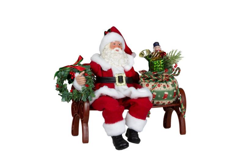 Christmas Paradise Weihnachtsmann sitzend 28cm auf Bank (Santa, 1 St., Weihnachtsdeko), mit buntem Geschenkesack und Weihnachtskranz von Christmas Paradise
