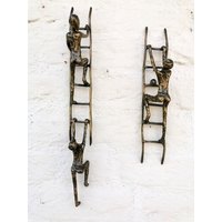 Bronze-Wand-Dekoration - Personen Auf Leiter Dekorative Bronze Wandschmuck von Decopunch