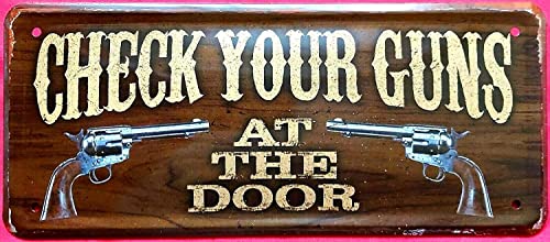 DekoDrom® Blechschild 28x12 cm witziges Wand Schild Wilder Westen Check Your Guns at The Door Saloon Hotel Bar Kneipe Haus + Garten Revolver Waffen Pistole 006 von DekoDrom