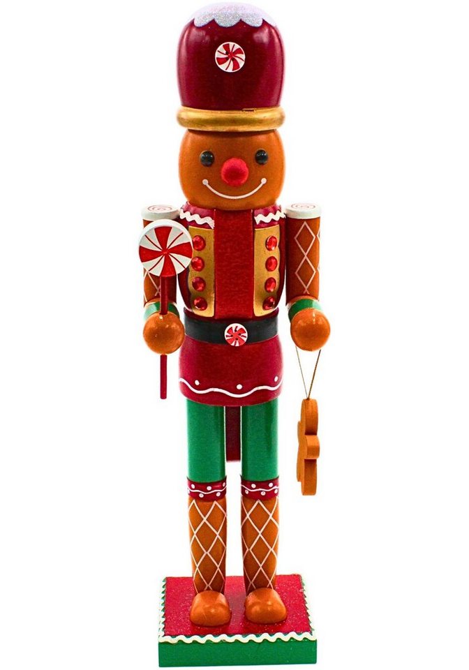 Dekohelden24 Nussknacker Holz Nussknacker mit Lebkuchenelemente, Ausführung über Menü wählbar., mit Lebkuchengebäck und Zuckerlutscher, Größe L/B/H ca. 9 x 11 x 35 cm von Dekohelden24