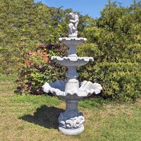 Dreistufiger Kaskaden Brunnen für den Garten aus Steinguss - Junge mit Fisch Figur - Marino / Tyrolia von Gartentraum.de
