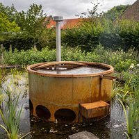 Runder Garten Whirlpool mit Verkleidung aus Cortenstahl - Nakia von Gartentraum.de