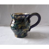Vintage Studio Keramik Milchkännchen Mehrfarbiges Steingut Mit Seil-Drehgriff von GaslightTreasures