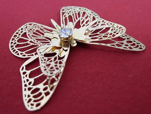 Deko Metall Schmetterling mit Schmuckstein Gold ca. 5 cm Deko Metall Schmetterling mit Schmuckstein Gold ca. 5 cm von Generic