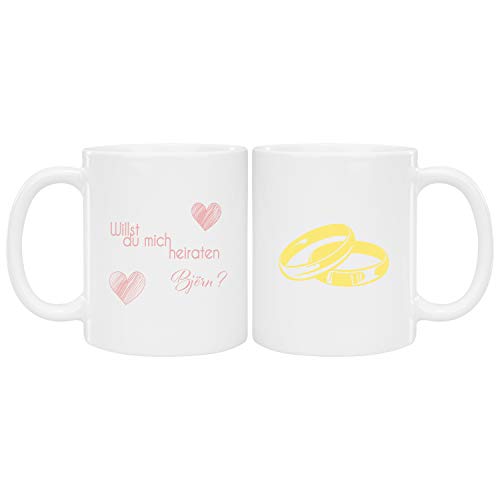 Geschenke 24 Tasse - Willst Du mich heiraten (Eheringe mit Name): Zaubertasse als origineller Heiratsantrag - magic mug in weiß/rosa - Partner Geschenke, personalisierte Geschenkidee von Geschenke 24