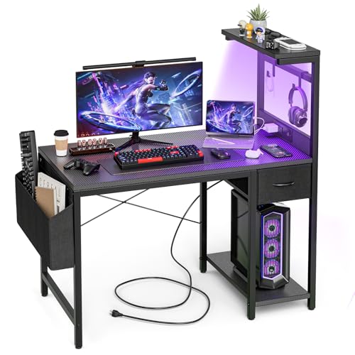 Grandder Gaming-Schreibtisch mit Steckdose und LED-Licht, Computertisch mit wendbaren Regalen und Aufbewahrungsschublade, PC-Tisch für Heimbüro, Tisch mit Tasche, Karbonfaser, Schwarz Grandder Gaming-Schreibtisch mit Steckdose und LED-Licht, Computertisch mit wendbaren Regalen und Aufbewahrungsschublade, PC-Tisch für Heimbüro, Tisch mit Tasche, Karbonfaser, Schwarz von Grandder