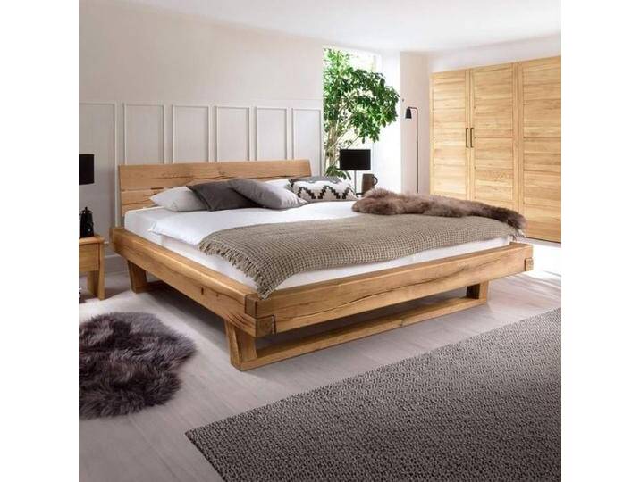 HOMELIV. Balkenbett Rigolato Komfort Wildeiche Massivholz in Überlänge 180x220cm rustikal, Mit Kopfteil von HOMELIV
