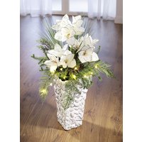 Beleuchtetes Amaryllis-Gesteck in Vase von KLINGEL DE