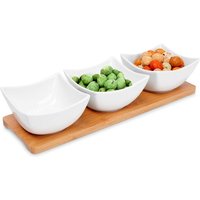 Three elegant porcelain bowls on a bamboo tray for snacks and dips von KOOPMAN