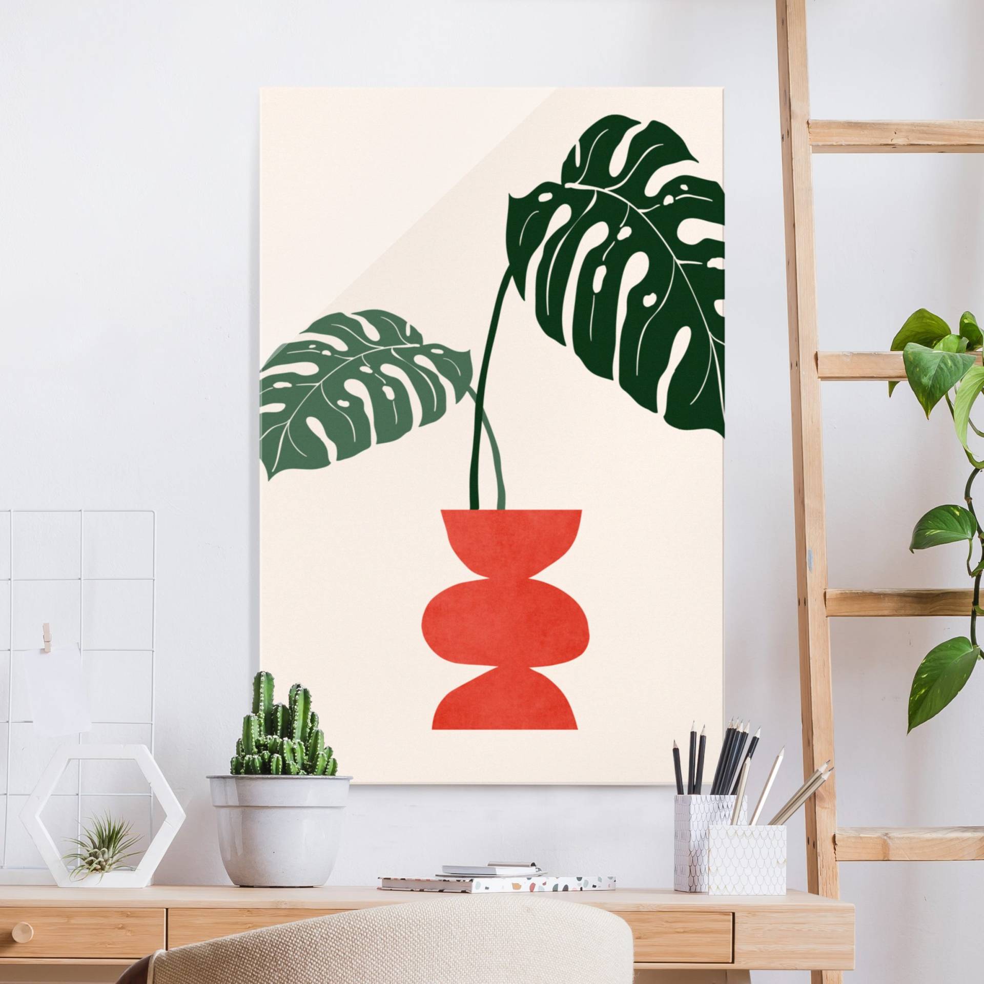 Glasbild Monstera in roter Vase von Klebefieber