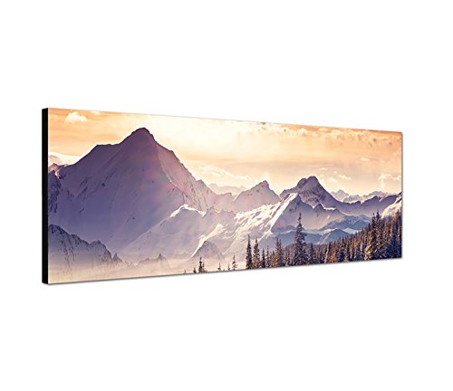 Wandbild auf Leinwand als Panorama in 150x50cm Berge Wald Schnee Wolken Sonnenstrahlen von Leinwandparadies