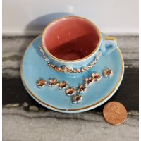 Winzige Rozan Brand Teetasse Mit Untertasse von LokisLootCo