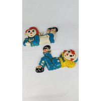 Vintage Bobbs Merrill Rtagdy Ann & Andy Wanddekor Plaketten Kunststoff 2Er Set Von 1977 von MashliDesign