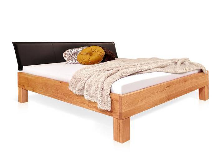 DAKONA 4-Fuß-Massivholzbett mit Polsterkopfteil, 120 x 200 cm DAKONA 4-Fuß-Massivholzbett mit Polsterkopfteil, 120 x 200 cm von Möbel-Eins