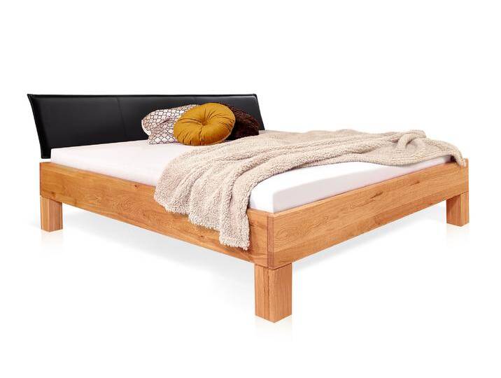 DAKONA 4-Fuß-Massivholzbett mit Polsterkopfteil, 120 x 200 cm DAKONA 4-Fuß-Massivholzbett mit Polsterkopfteil, 120 x 200 cm von Möbel-Eins