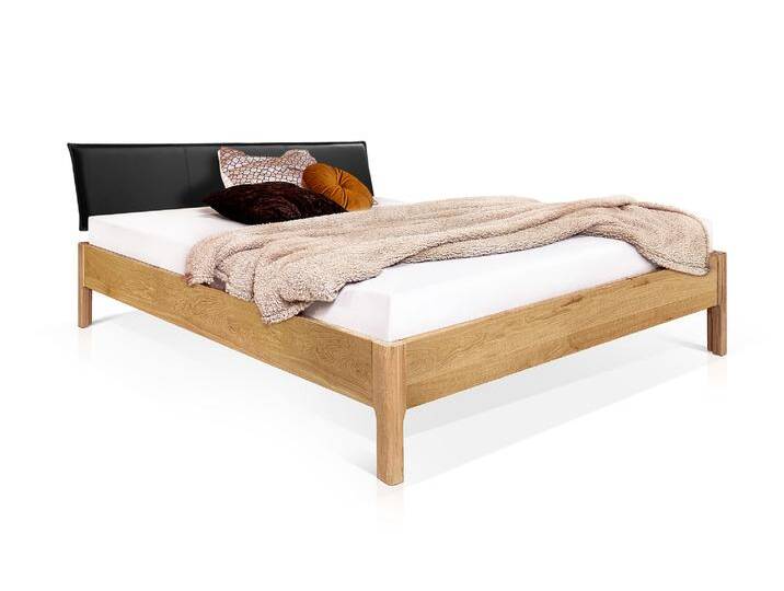 MERANO 4-Fuß-Massivholzbett mit Polsterkopfteil, 120 x 200 cm MERANO 4-Fuß-Massivholzbett mit Polsterkopfteil, 120 x 200 cm von Möbel-Eins