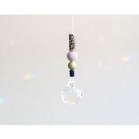 Sonnenfänger Flieder Lingrün Blau Schwarz Gefleckt - 3 cm Glaskristall Mit Silikon- Und Keramikperlen Sonnenfänger Flieder Lingrün Blau Schwarz Gefleckt - 3 cm Glaskristall Mit Silikon- Und Keramikperlen von MoinMia