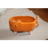 Pflanzgefäß Katze, Orange, Keramik, L 15 cm, H 10 Tiefe 8 Bepflanzbare Katze Aus Keramik Pflanzgefäß Katze, Orange, Keramik, L 15 cm, H 10 Tiefe 8 Bepflanzbare Katze Aus Keramik von Monisdekoshop