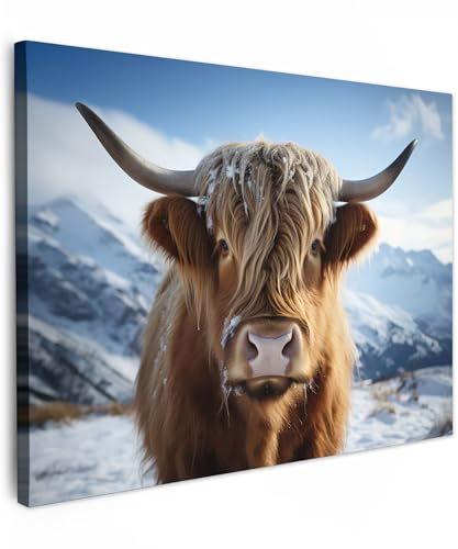 MuchoWow© Leinwandbild 40x30 cm Dekoration Wohnzimmer Bilder Aufhängen Wall Decoration Living Room Wohnungs Deko Moderne Schottische Hochlandrind - Kuh - Highland Cow - Berge - Schnee von MuchoWow