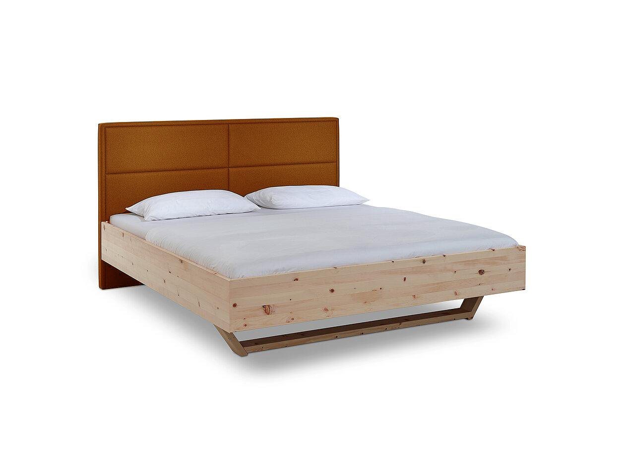 Natur24 Einzelbett Luganox Bett aus Zirbe massiv 140x200 cm mit Stoffkopfteil Orange von Natur24