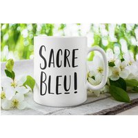 Tasse Mit Spruch "Sacre Bleu" - Französisch Fluchen Lustige Kaffeetasse Arbeit Bürotasse Geschenkideen Für Kollegen/ Kollegin Tasse Mit Spruch "Sacre Bleu" - Französisch Fluchen Lustige Kaffeetasse Arbeit Bürotasse Geschenkideen Für Kollegen/ Kollegin von OfficeRebelDesigns