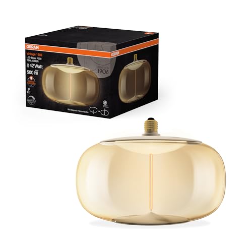 OSRAM Vintage 1906 Big Elipse ist eine dimmbare LED-Lampe aus Kunststoff mit Filament in Ellipsenform. Sie bietet 12 W für 500 lm, E27 Fassung, Bernstein Design, 300 mm Durchmesser, CRI 80, 1800 K. OSRAM Vintage 1906 Big Elipse ist eine dimmbare LED-Lampe aus Kunststoff mit Filament in Ellipsenform. Sie bietet 12 W für 500 lm, E27 Fassung, Bernstein Design, 300 mm Durchmesser, CRI 80, 1800 K. von Osram