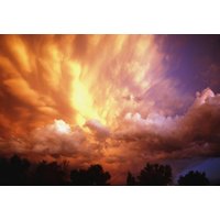 Papermoon Fototapete "Gewitterwolken bei Sonnenuntergang" von Papermoon