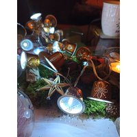 Lichterkette Aus Kaffeekapseln Lichterkette Aus Kaffeekapseln von PrettyTrashDesign