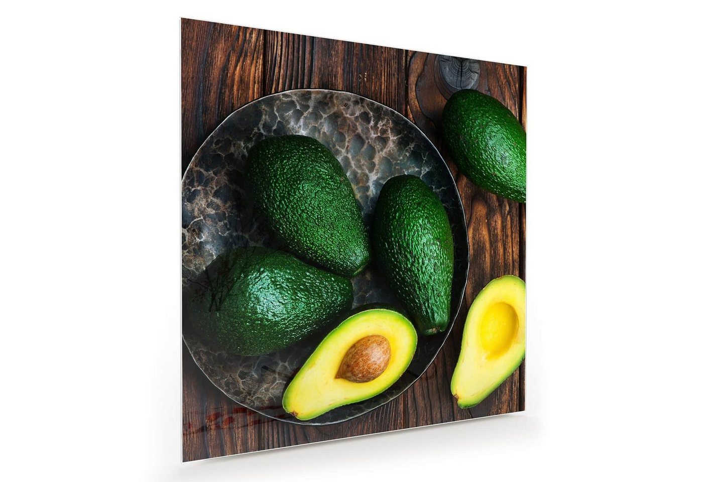 Primedeco Glasbild Wandbild Quadratisch Avocado auf Teller mit Aufhängung, Früchte von Primedeco