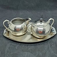Vintage Metall Milchknöpfe Und Zucker Set Mit Tablett Dovo Made in Holland Sammlerstück von Randomness4sale