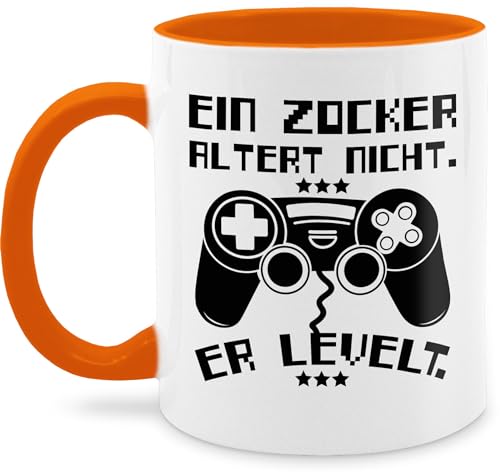 Tasse Tassen 325ml - Statement Sprüche - Ein Zocker altert nicht - er levelt - 325 ml - Orange - gamertasse spruchtasse sarkasmus gamer kaffeetasse geschenk nerd spruchtassen spruch gaming von Shirtracer