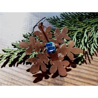 Kupferne Schneeflockenverzierung von SilverBB