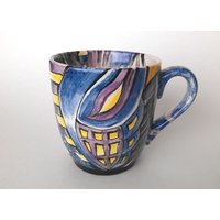 Handbemalte Keramiktasse in Blau-, Lila - Und Orangetönen von StevenMarkJohnson