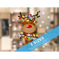 Fensterbild Rentier Mit Lichtern von Stickers4dotcom