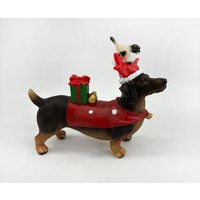 Dekofigur Dackel Polyresin 17 cm bunt Weihnachtscharaktere Dekofigur Dackel Polyresin 17 cm bunt Weihnachtscharaktere von TRENDLINE
