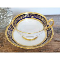 Vintage Paragon Teetasse, Stern Logo Um 1930Er Jahre, Kobalt Und Goldbänder Entlang Rand, Teetasse Untertasse Mit Breitem Mund, Made in England Vintage Paragon Teetasse, Stern Logo Um 1930Er Jahre, Kobalt Und Goldbänder Entlang Rand, Teetasse Untertasse Mit Breitem Mund, Made in England von Trashtiques
