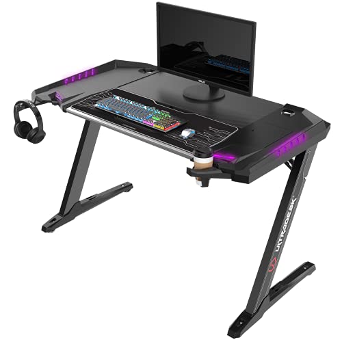 ULTRADESK Rocket | Computertisch Gaming-Schreibtisch mit XL-Pad, LED-RGB-Beleuchtung in 7 Farben, Steckplatz für Mobile Geräte, Ablagefach | verstärkte Metallkonstruktion, Schwarz, 128x68 cm von ULTRADESK