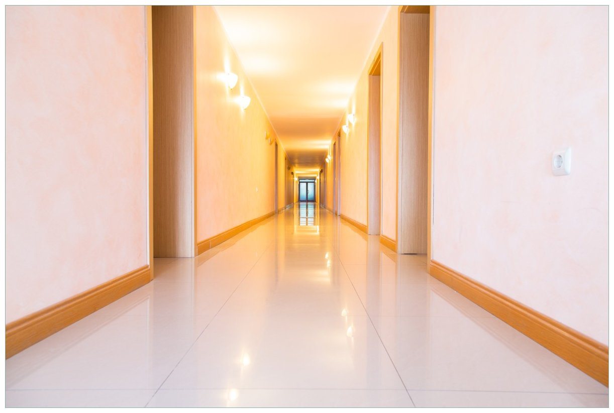 Wallario Acrylglasbild, Strahlend sauberer Flur mit goldenem Licht und weißen Wänden, in verschiedenen Ausführungen von Wallario