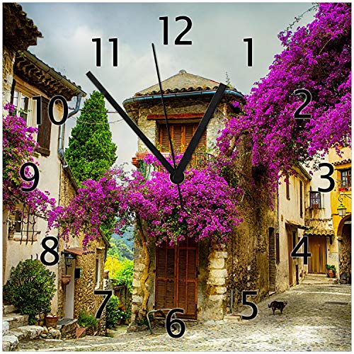 Wallario Design-Wanduhr Malerische Stadt in der Provence mit bunten Blumen aus Glas, Motiv-Uhr Größe 30 x 30 cm, Schwarze Zeiger von Wallario