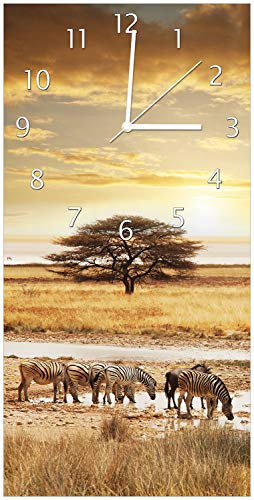 Wallario Design-Wanduhr Safari in Afrika eine Herde Zebras am Wasser aus Glas, Motiv-Uhr Größe 30 x 60 cm, weiße Zeiger von Wallario