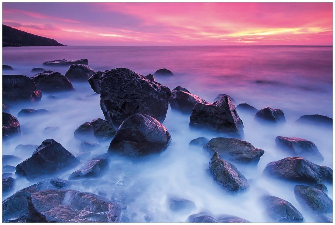 Wallario Glasbild, Felsen im Meer bei Sonnenuntergang, in verschiedenen Ausführungen von Wallario