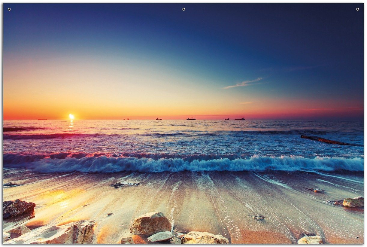 Wallario Sichtschutzzaunmatten Sonnenuntergang am Meer mit Wellen am Strand von Wallario