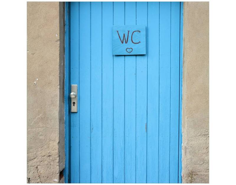 Wallario Tischplatte Blaue Tür einer Toilette in einer verlassenen Fabrik in Magdeburg (1 St), für Ikea Lack Tisch geeignet von Wallario