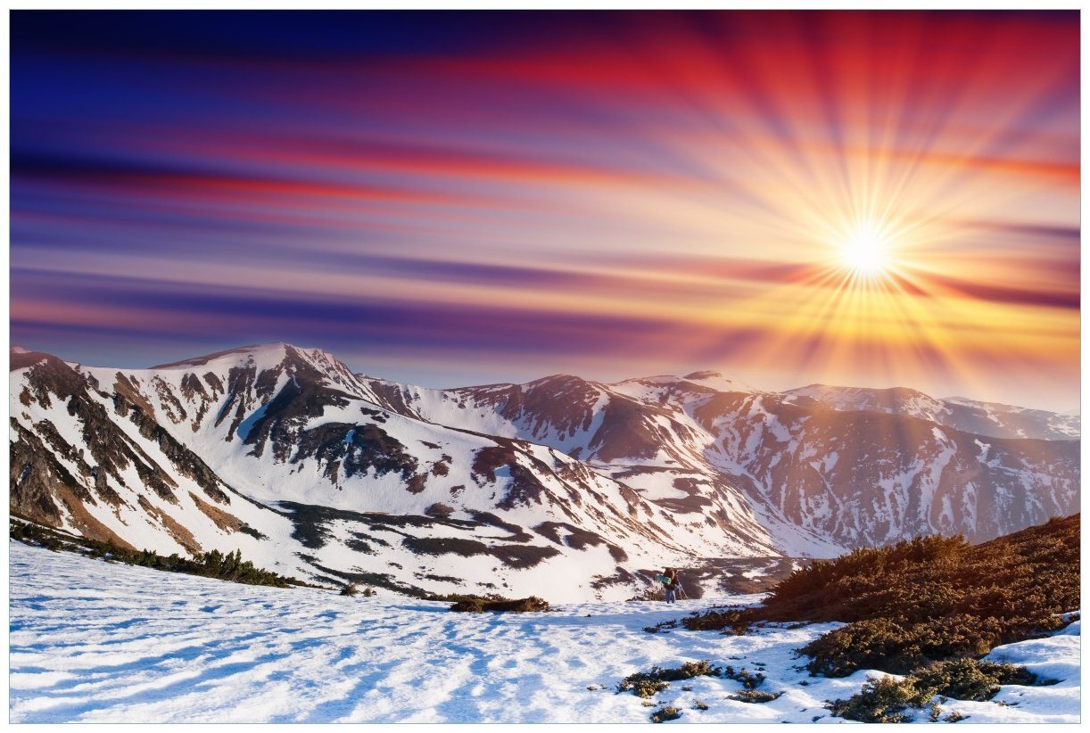 Wallario Wandfolie, Farbenfroher Sonnenuntergang im Winter - Schnee in den Bergen, in verschiedenen Ausführungen von Wallario