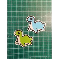 Cute Dinosaur/Nessie Fridge Magnet | Blue Or Green von ZombietoastcosplayDE