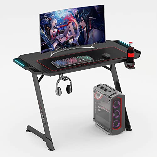 eXcape Gaming Tisch Z10 mit LED Beleuchtung 100cm (+16cm Extensions) x 60cm - Carbon-Optik, Schreibtisch Gaming - inkl. Getränkehalter, Kopfhörerhalter - PC Tisch, Gamer Desk von eXcape