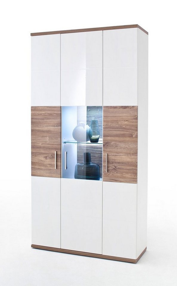 expendio Vitrine Lorenz 5 weiß Hochglanz / Sterling Oak Nb. montiert mit Beleuchtung 3D-Rückwand von expendio